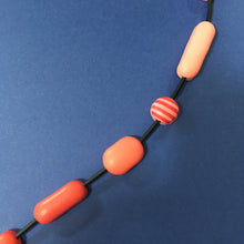 Load image into Gallery viewer, Comfits necklace in red, pink, orange and yellow contemporary necklace