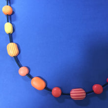 Load image into Gallery viewer, Comfits necklace in red, pink, orange and yellow contemporary necklace